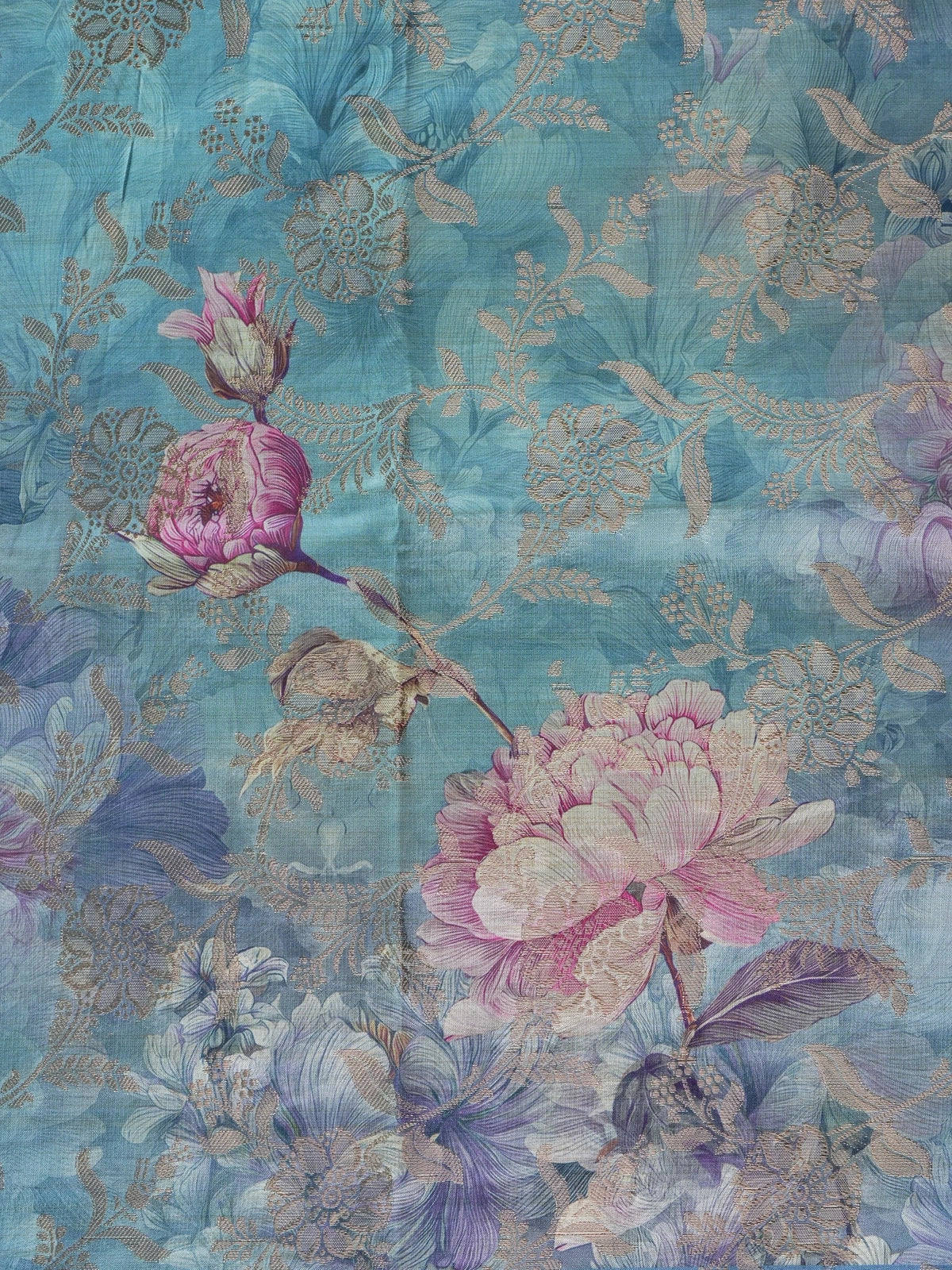 Teal blue semi tussar saree with pink floral print and contrast zari border