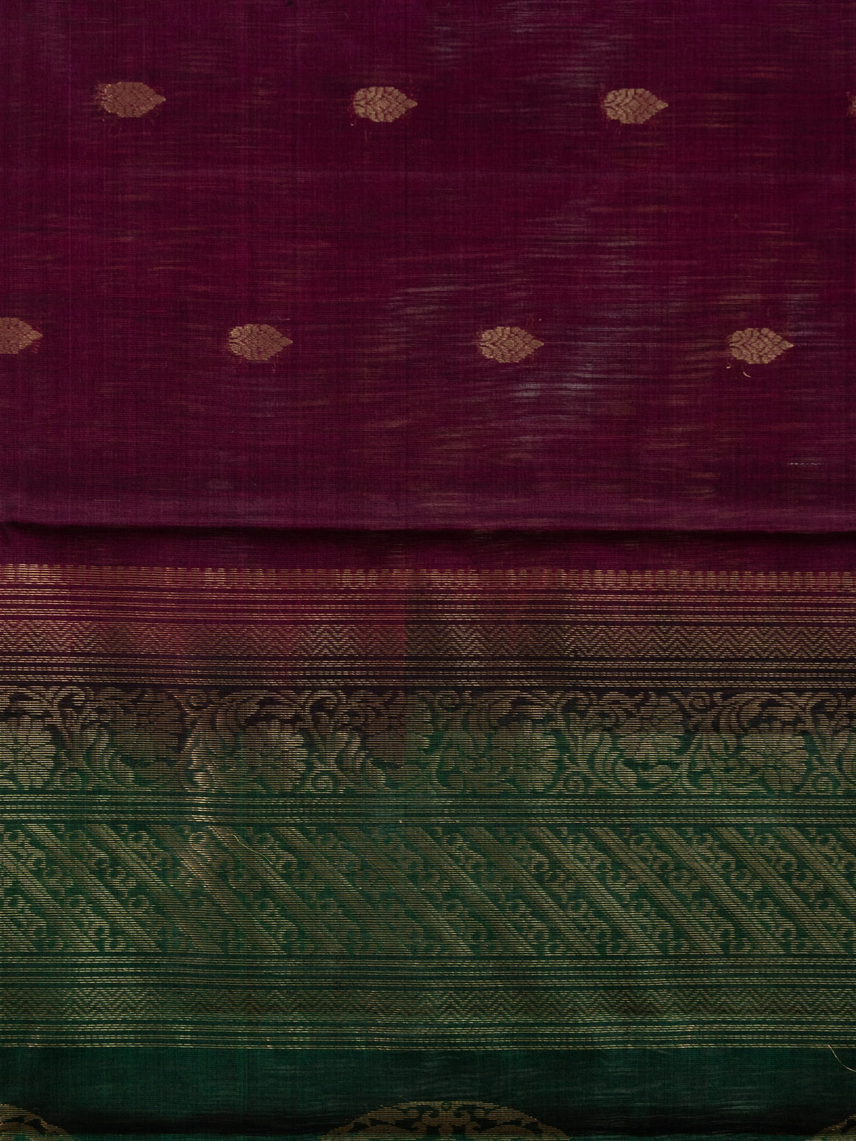 Purple pure silk cotton saree with contrast green zari border and gold peacock motif pallu