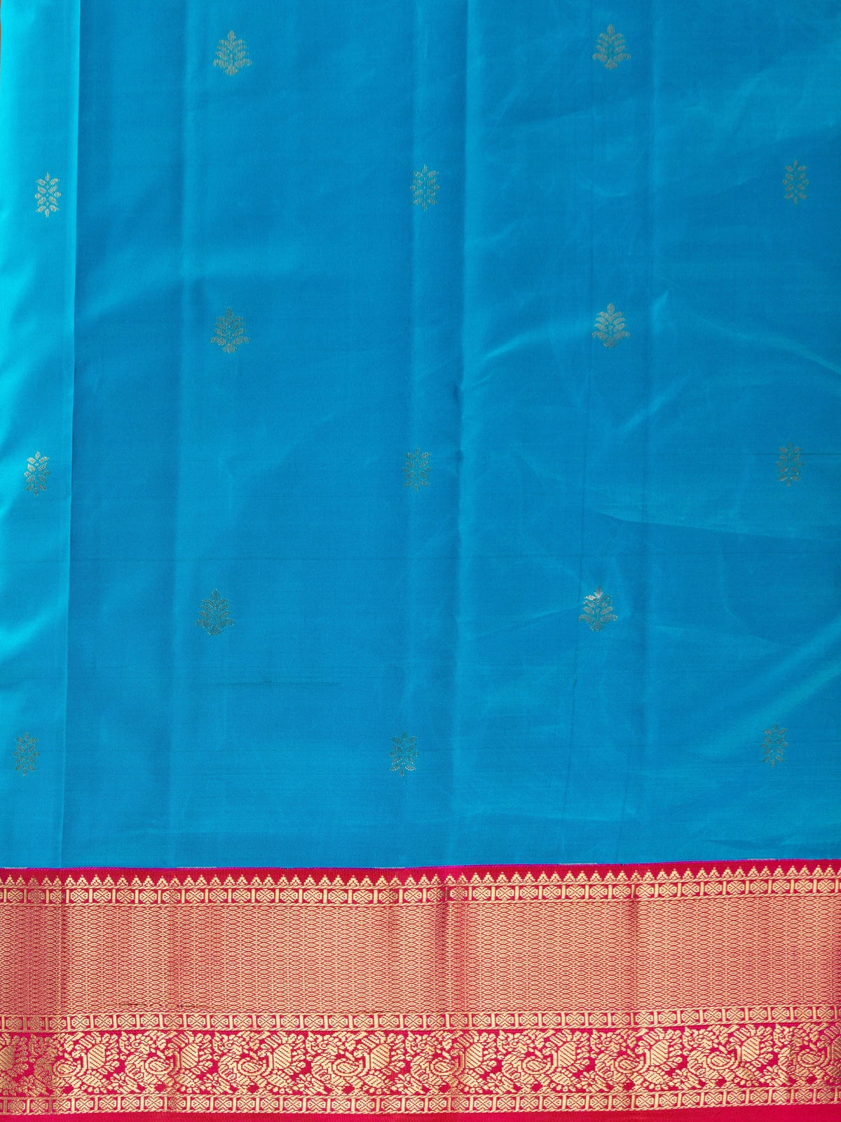 Peacock blue pure Kanchipuram silk saree with contrast pink and gold zari border and pallu