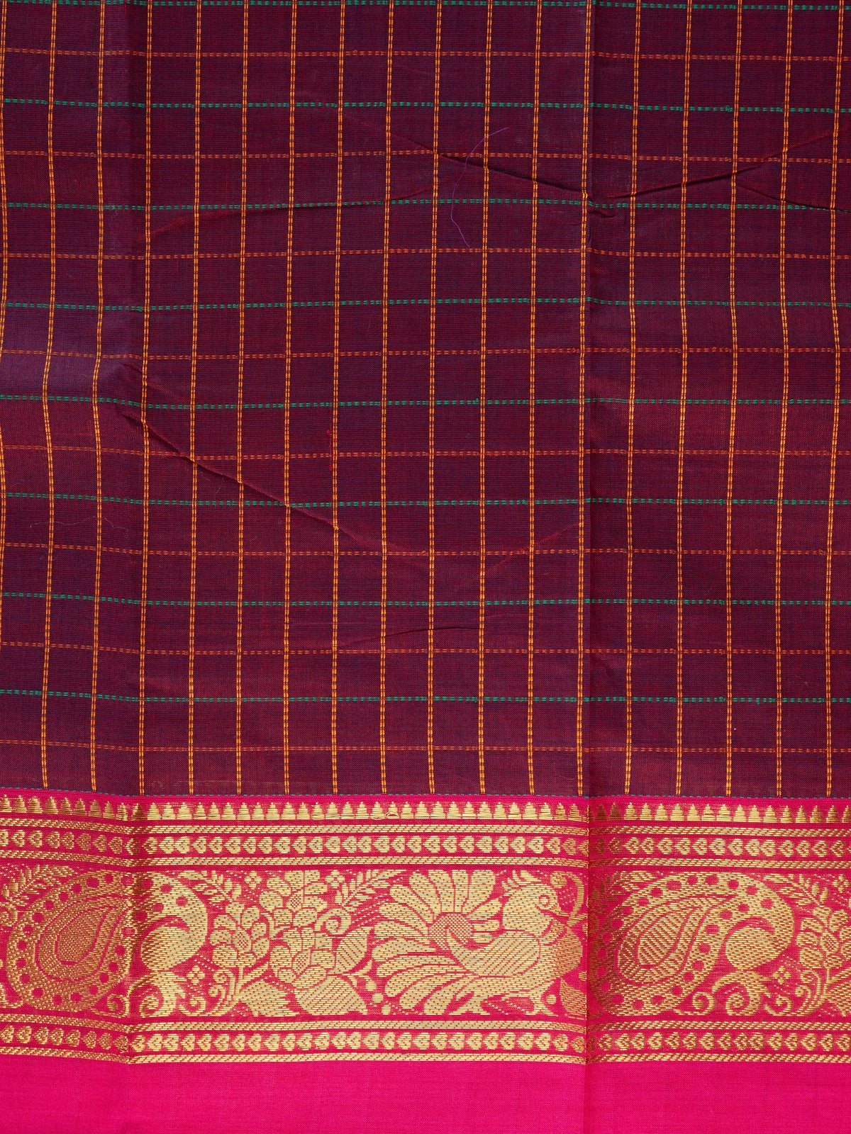 Maroon Chettinad cotton saree with checked body, contrast pink zari border and gold peacock motif pallu