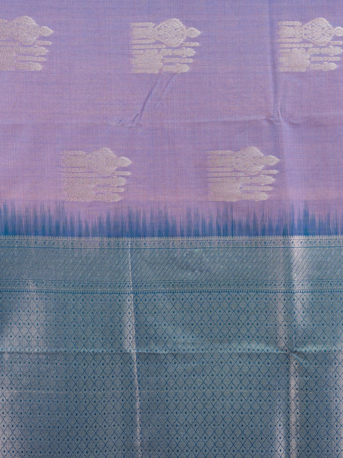Lavender semi silk saree with teal blue contrast border and silver zari buttas