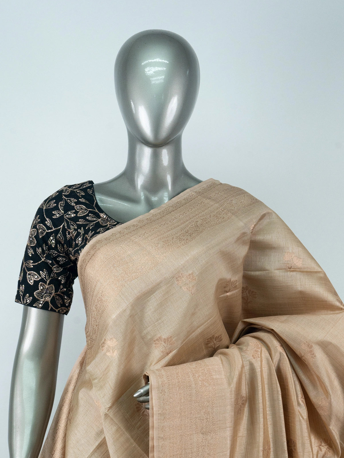 Beige semi raw silk saree with copper zari border and multicolour floral meenakari pallu
