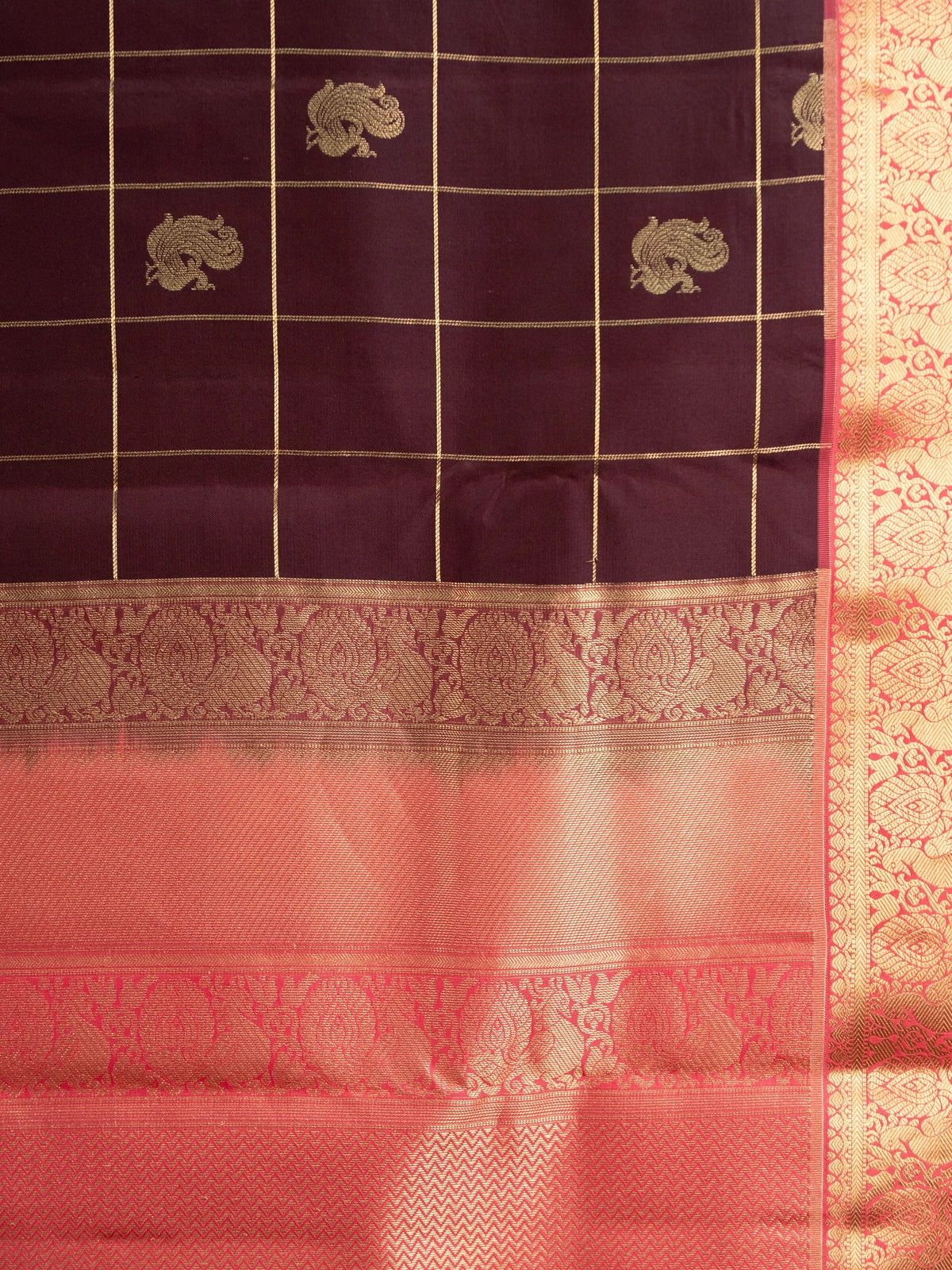 Deep wine pure Kanchipuram silk saree with gold zari checks, peacock motifs and coral pink contrast zari border