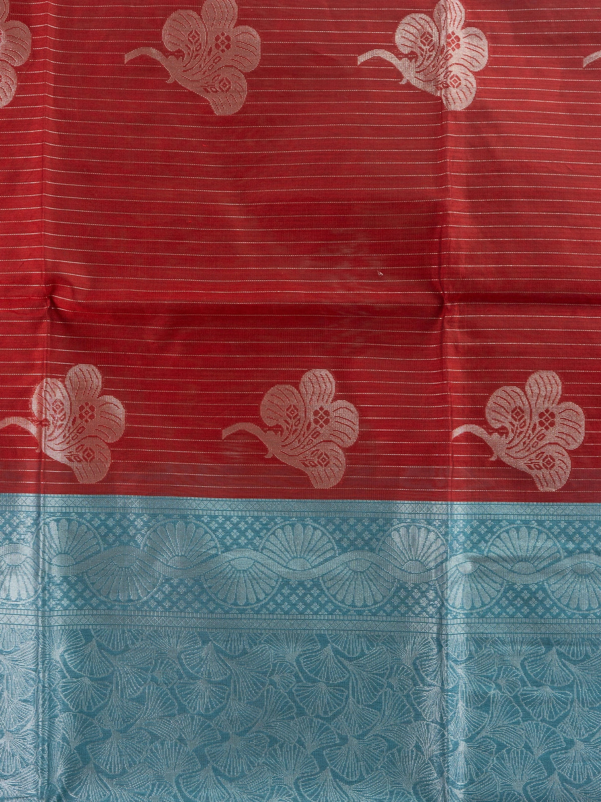 Maroon silk cotton saree with silver zari stripes, floral butta and contrast teal blue zari border