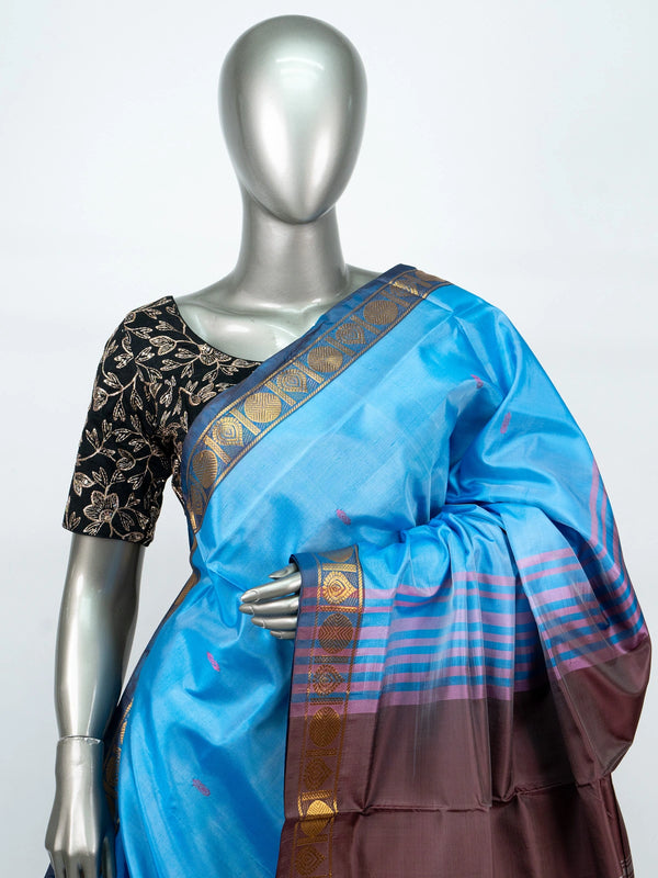 Sky blue banana silk saree with contrast brown pallu and gold zari border