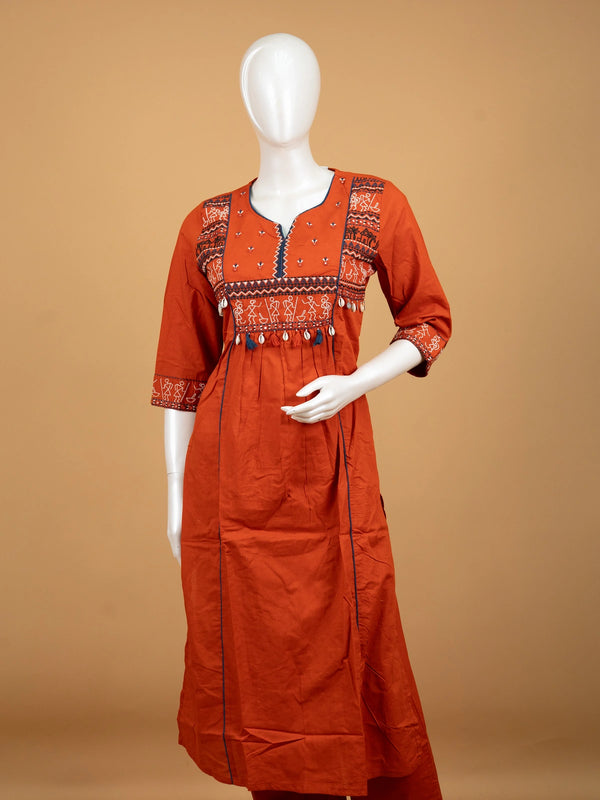 Rust orange cotton Warli embroidered Anarkali kurti set with cowrie shell tassels and matching dupatta