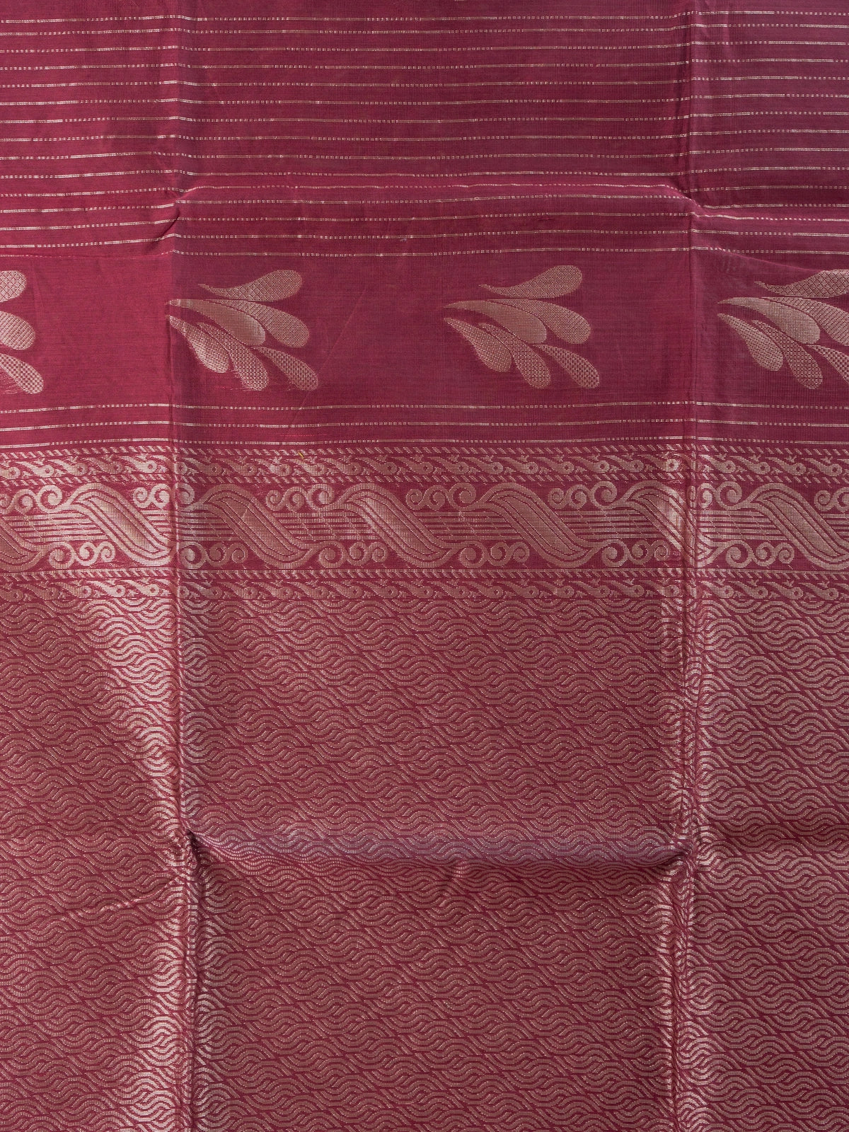 Maroon silk cotton saree with silver zari stripes, leaf motifs and woven scroll border