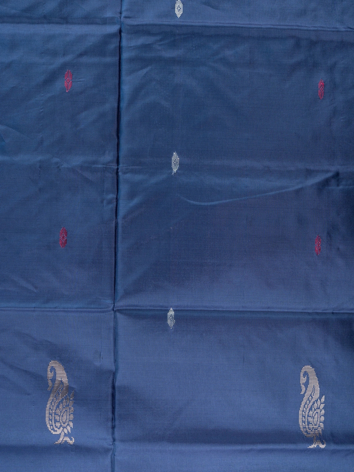 Navy blue banana silk saree with mustard contrast pallu and silver zari peacock buttas