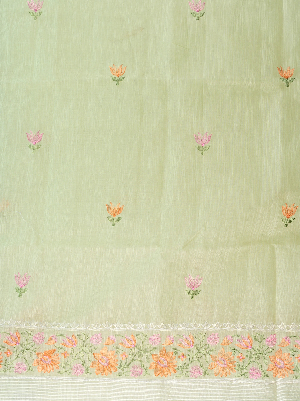Pastel green linen cotton saree with pink and orange floral embroidery and cream contrast border