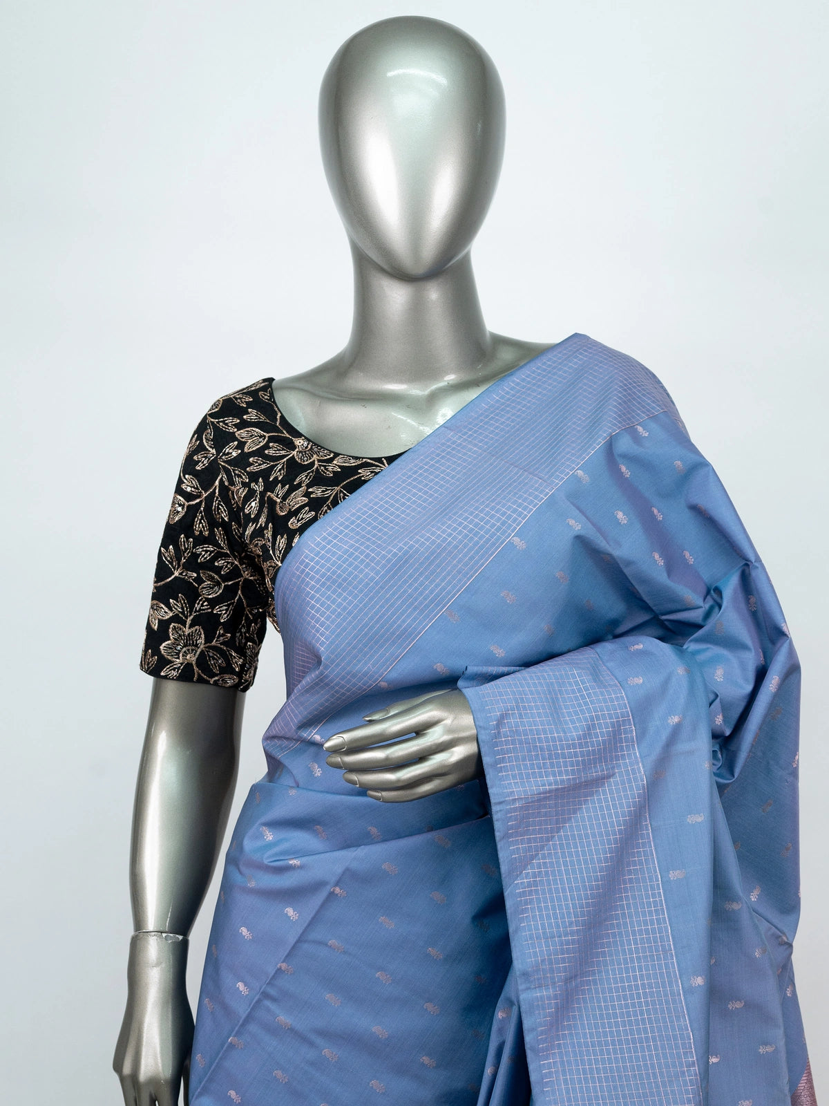Dusty blue-grey Vaira Oosi Design semi silk saree with silver zari buttis and contrast orange zari pallu and border