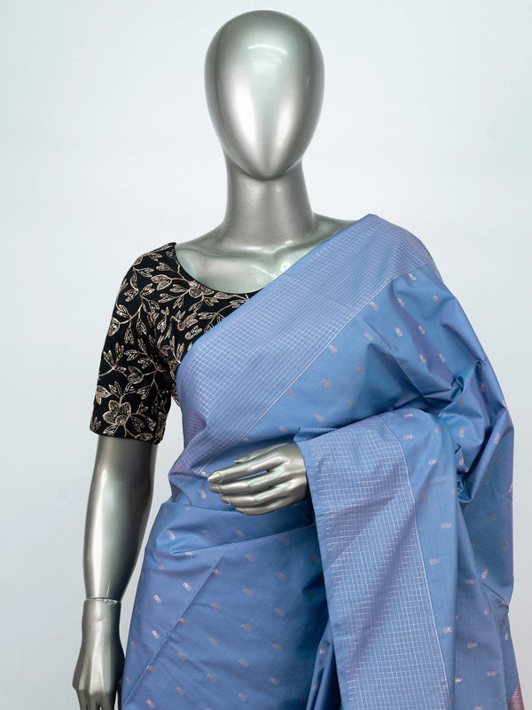 Dusty blue-grey Vaira Oosi Design semi silk saree with silver zari buttis and contrast orange zari pallu and border