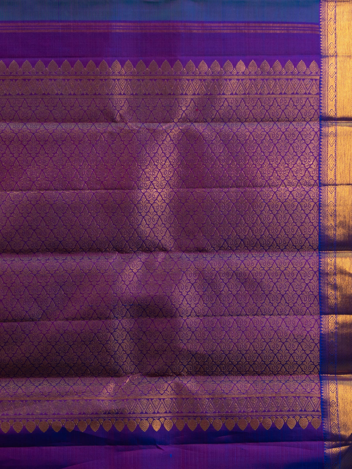 Peacock blue pure Kanchipuram silk saree with contrast purple gold zari border and paisley buttas