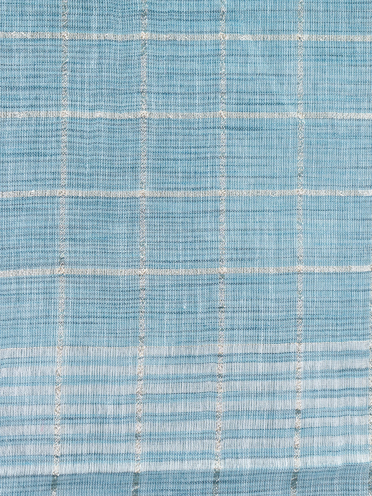Sky blue linen cotton saree with white and silver zari checked weave and striped pallu