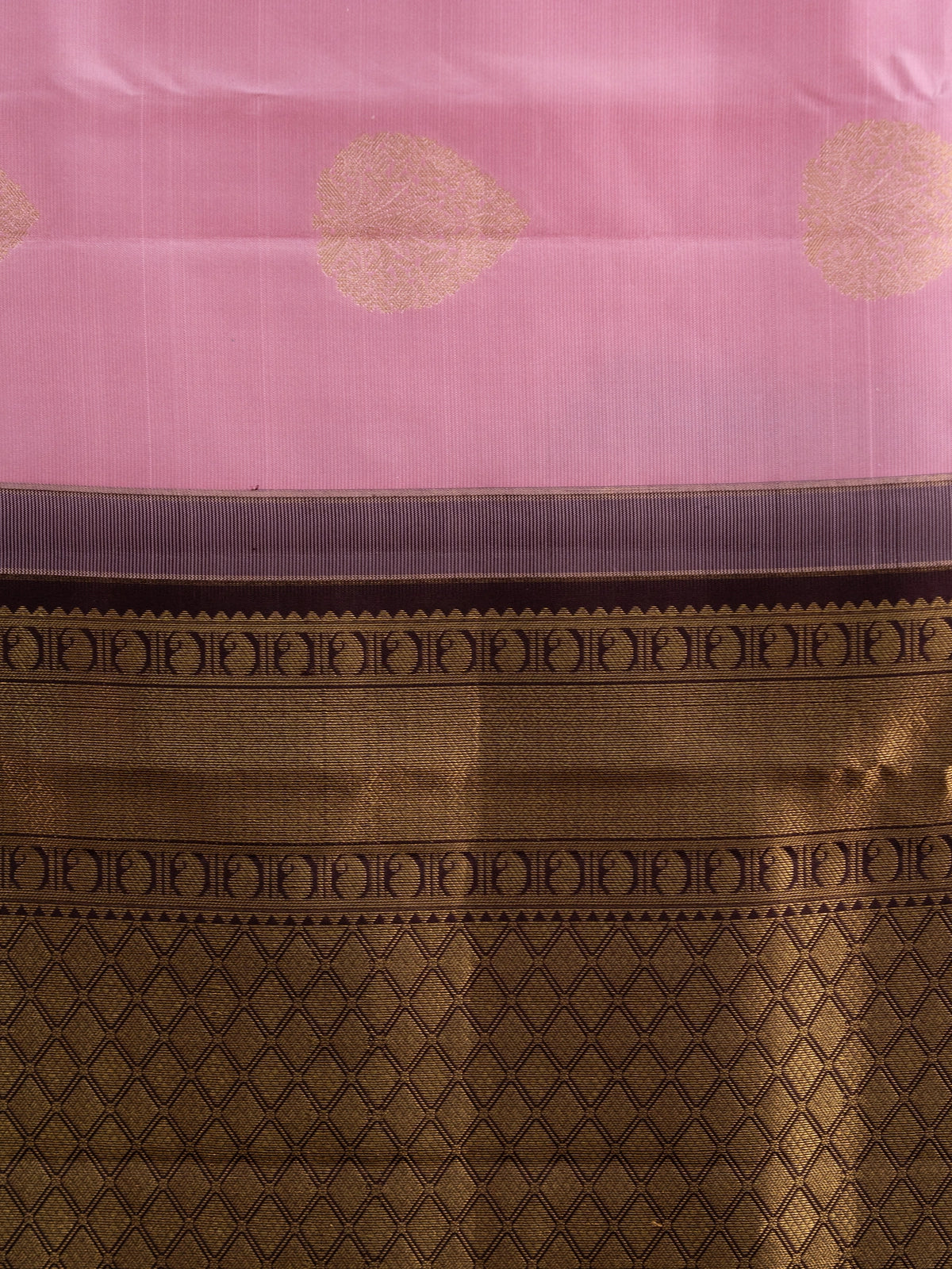 Pink pure Kanchipuram silk saree with contrast dark brown border and gold zari buti motifs