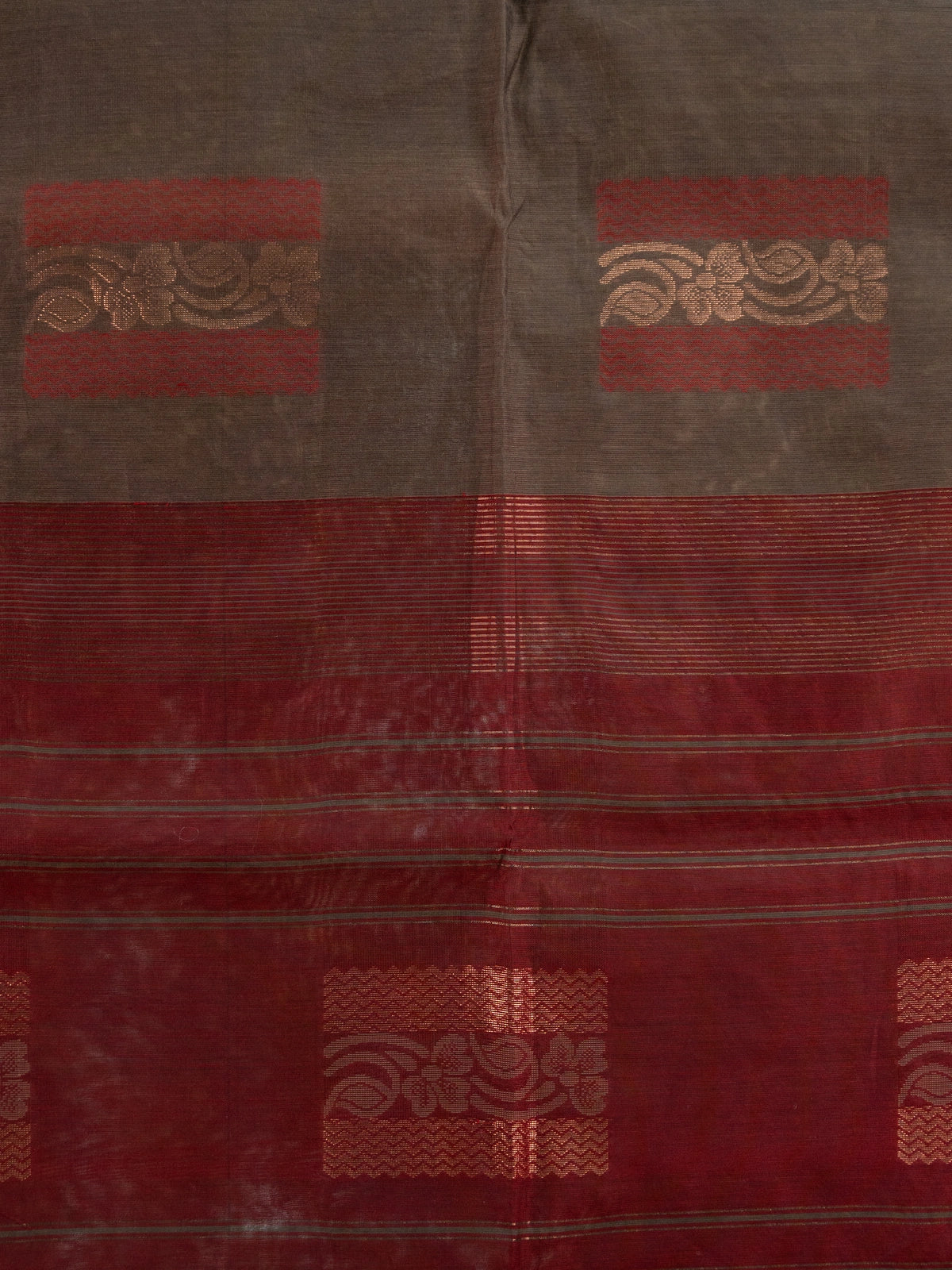 Brown silk cotton saree with contrast maroon border and copper zari butta motifs