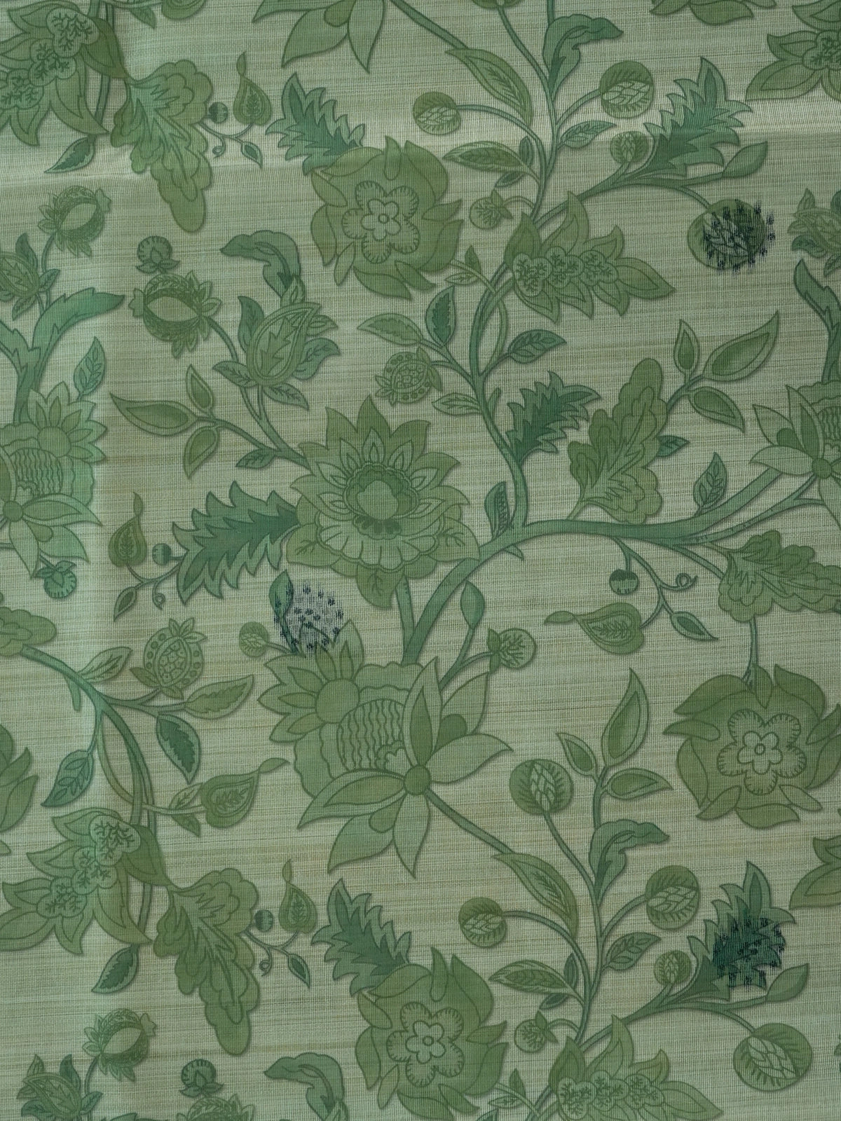 Sage green floral printed linen cotton saree with grey dotted border and tree-motif pallu