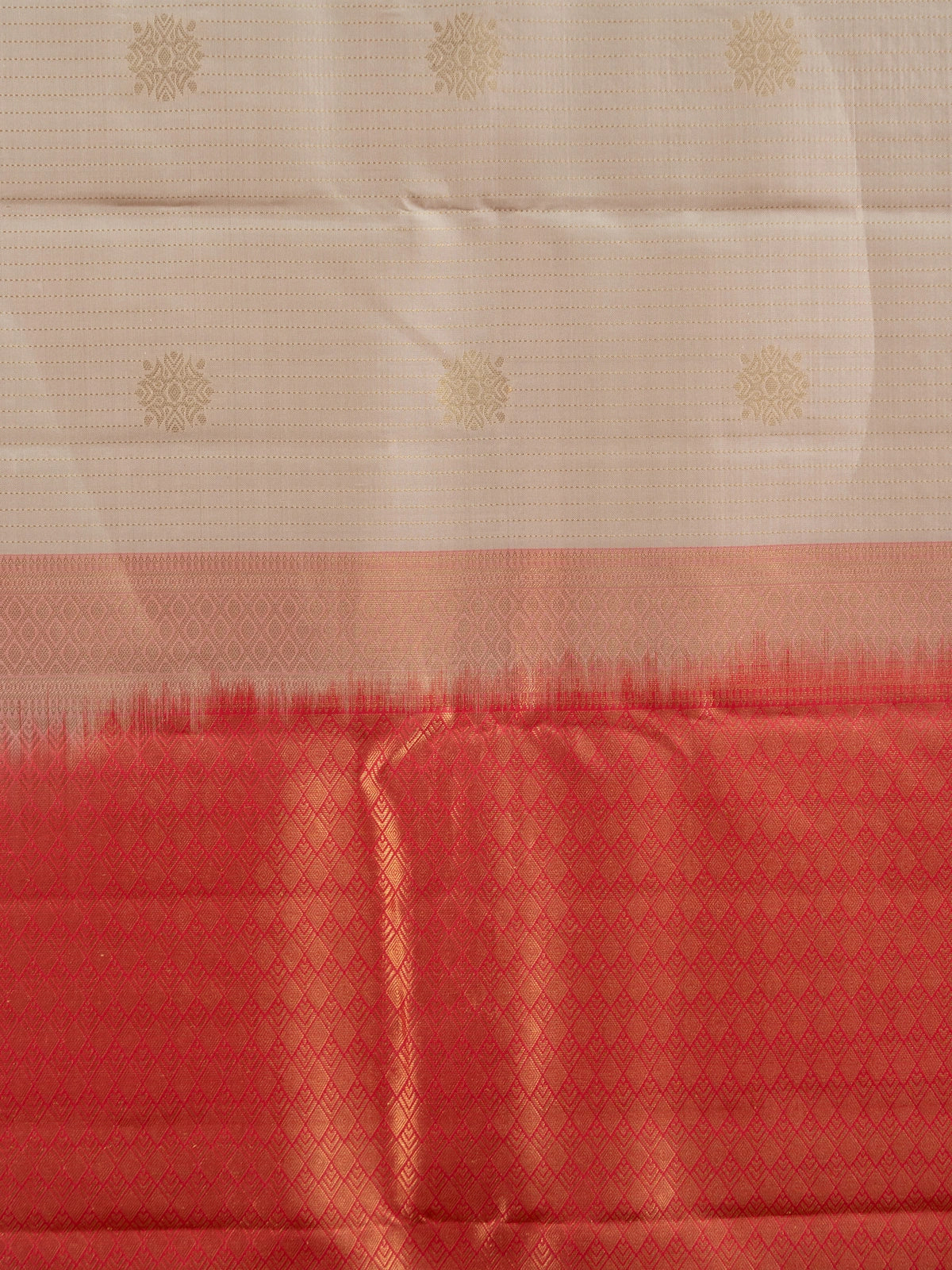 Cream and red pure Kanchipuram silk saree with gold zari border and buttas