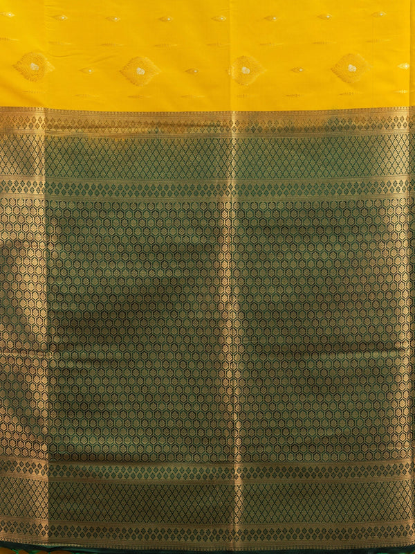 Mustard yellow Kanchipuram fancy silk saree with green contrast zari border and pallu