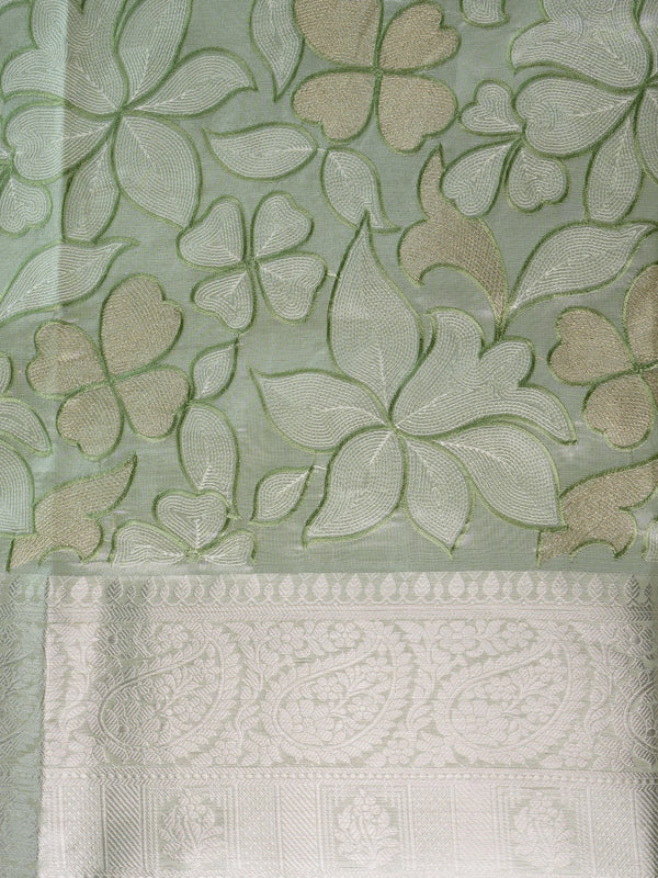 Sage green designer saree with cream-gold floral embroidery and silver zari border