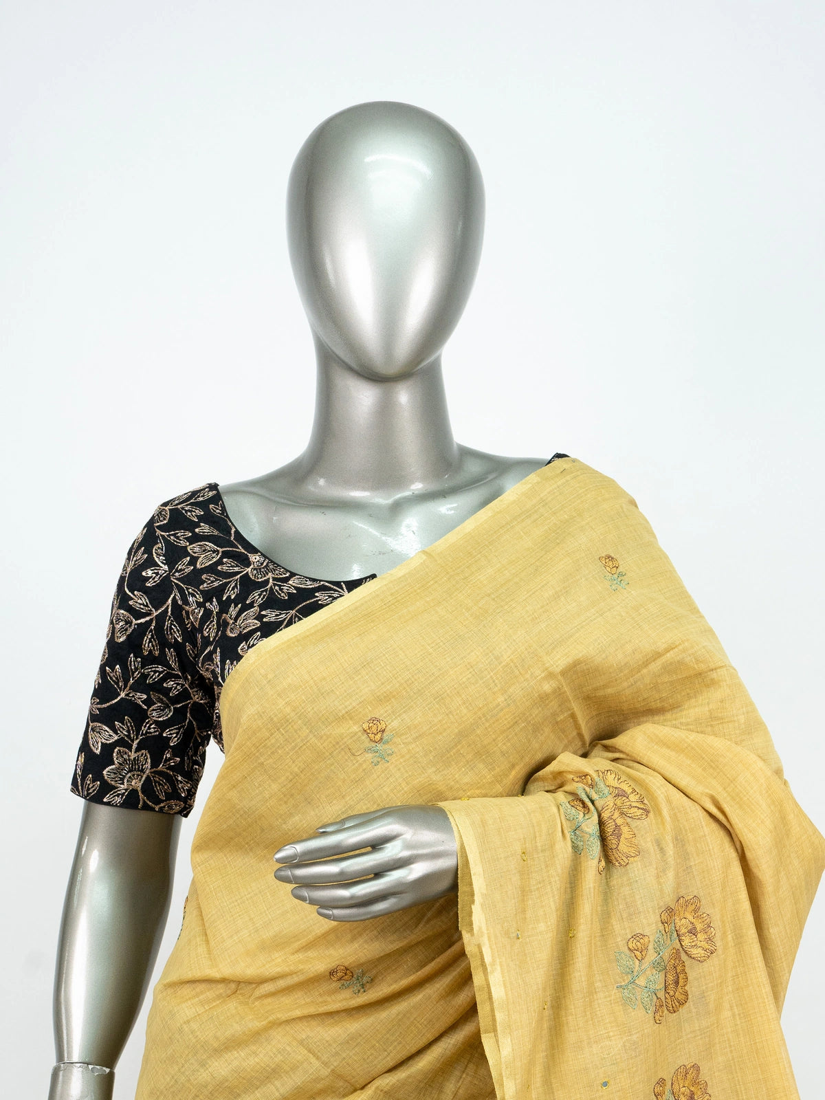 Yellow linen cotton saree with floral embroidered buttas and contrast black blouse