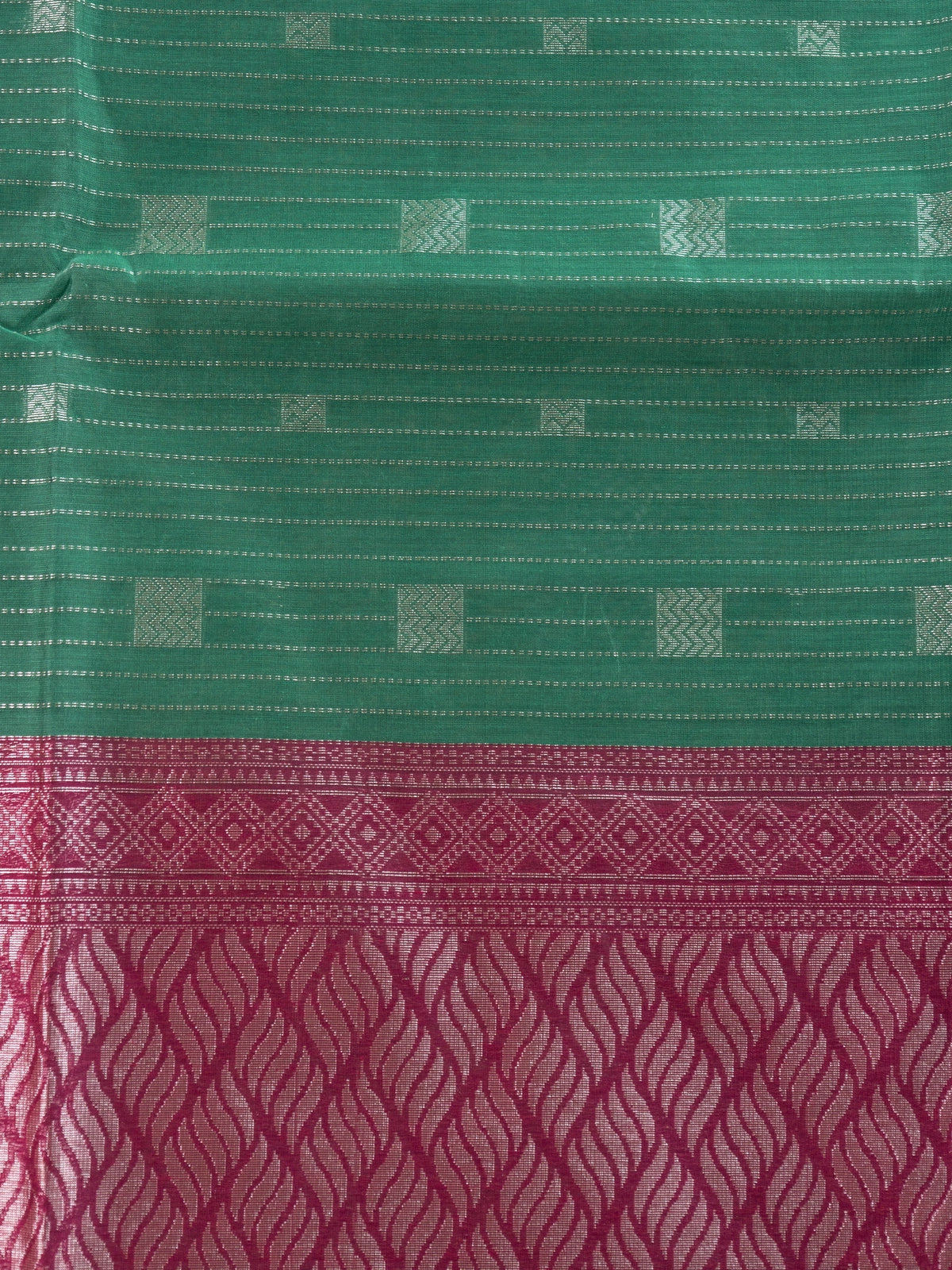 Green silk cotton saree with silver zari stripes and contrast magenta zari border and pallu
