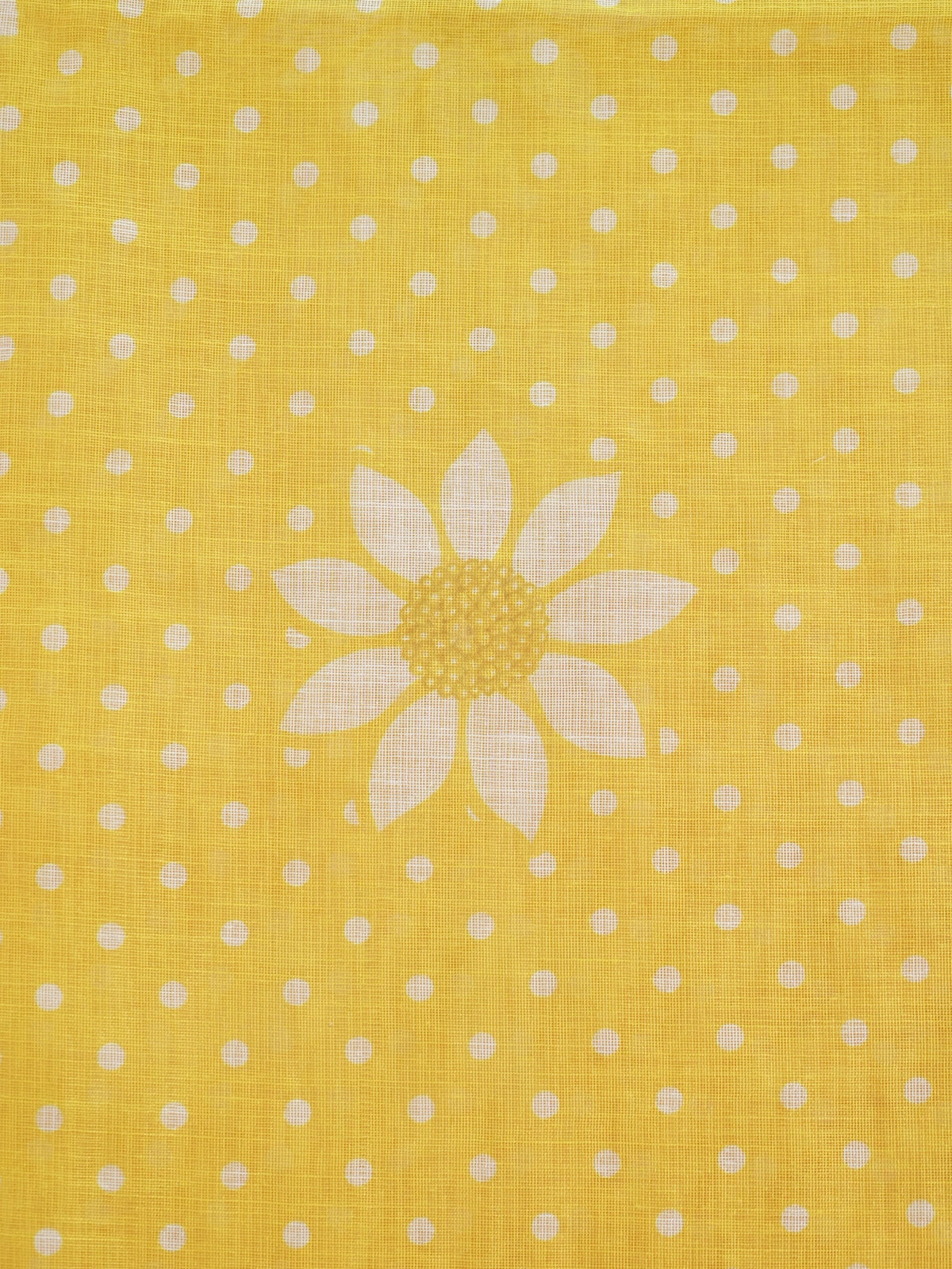 Yellow and white polka dot linen cotton saree with daisy floral prints and slim golden border