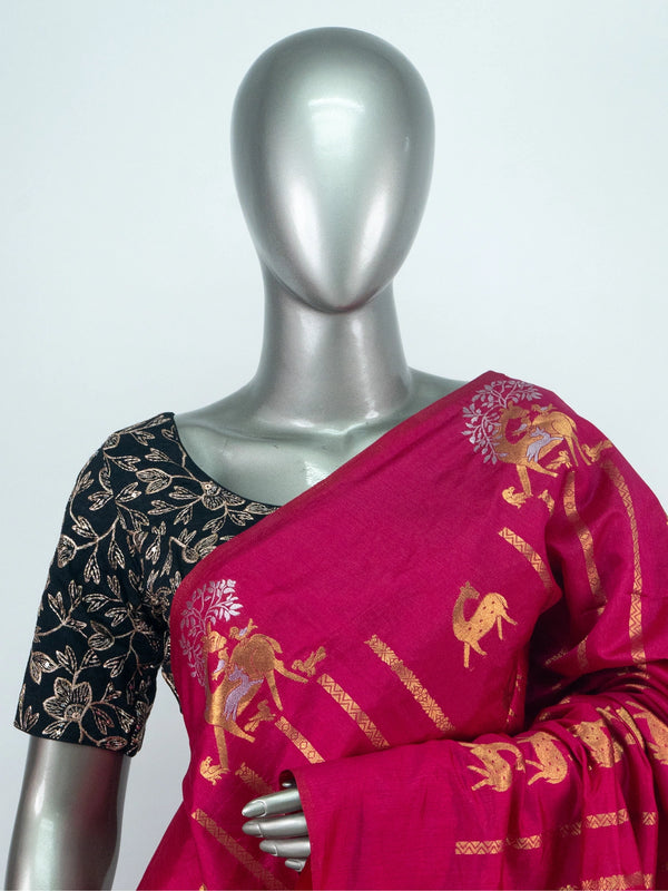 Rani pink semi raw silk saree with gold zari folk motifs, brocade pallu and contrast black blouse
