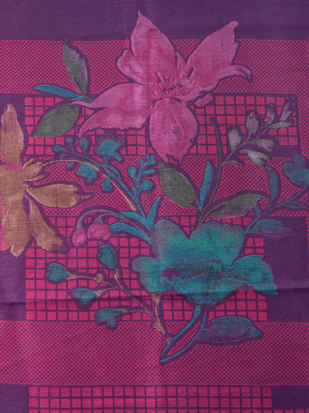 Purple Dola silk saree with pink floral print and gold zari contrast border