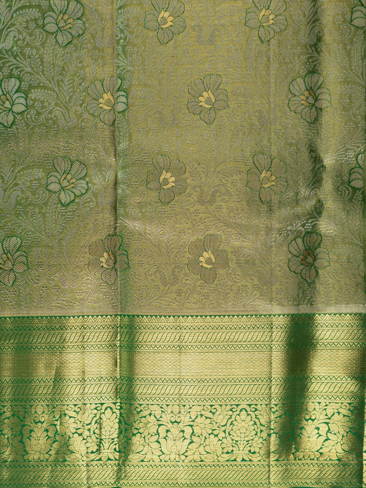 Green pure Kanchipuram silk saree with gold zari floral motifs and contrast border