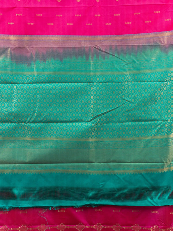 Rani pink Kanchipuram fancy silk saree with teal green contrast border, gold zari buttas and diamond-grid zari pallu
