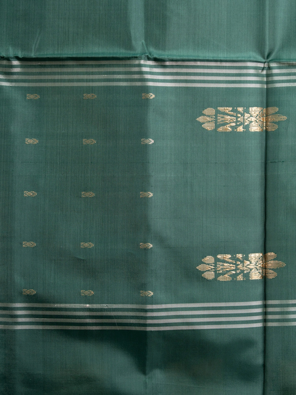 Green and peach checked banana silk saree with dark green zari pallu and border