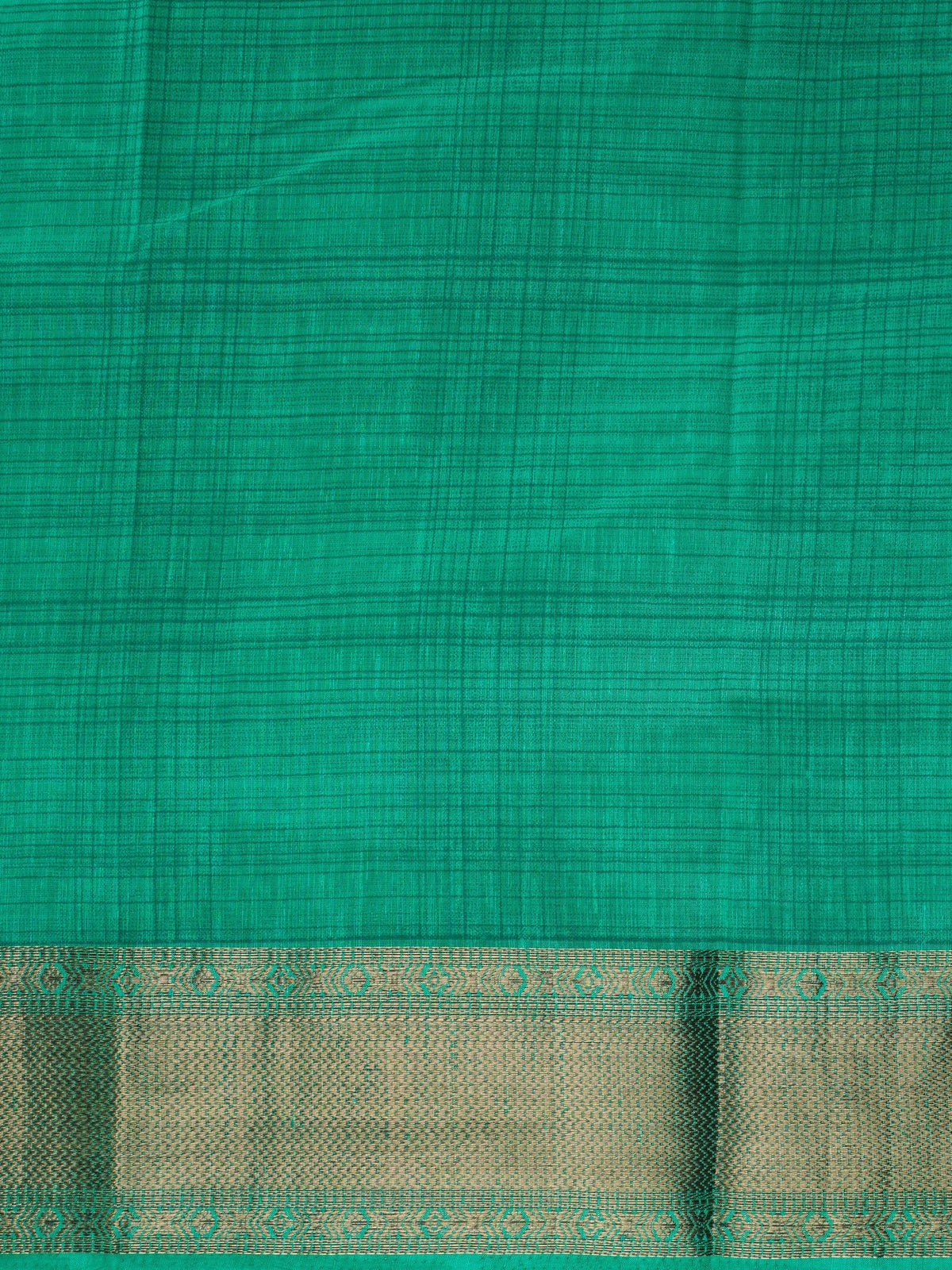 Green semi tussar saree with gold zari border and matching green butta blouse