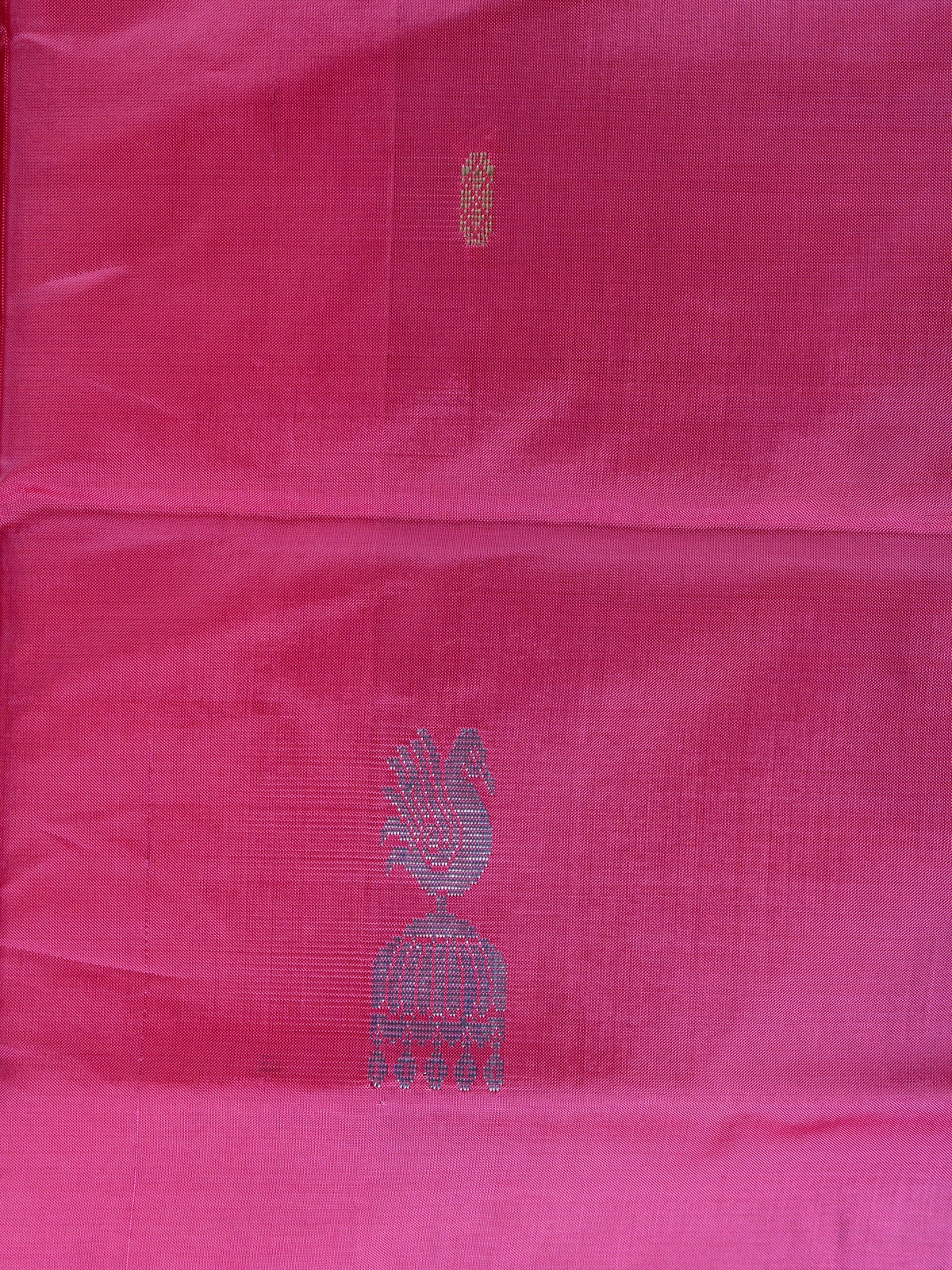 Pink banana silk saree with contrast green pallu and woven peacock motifs