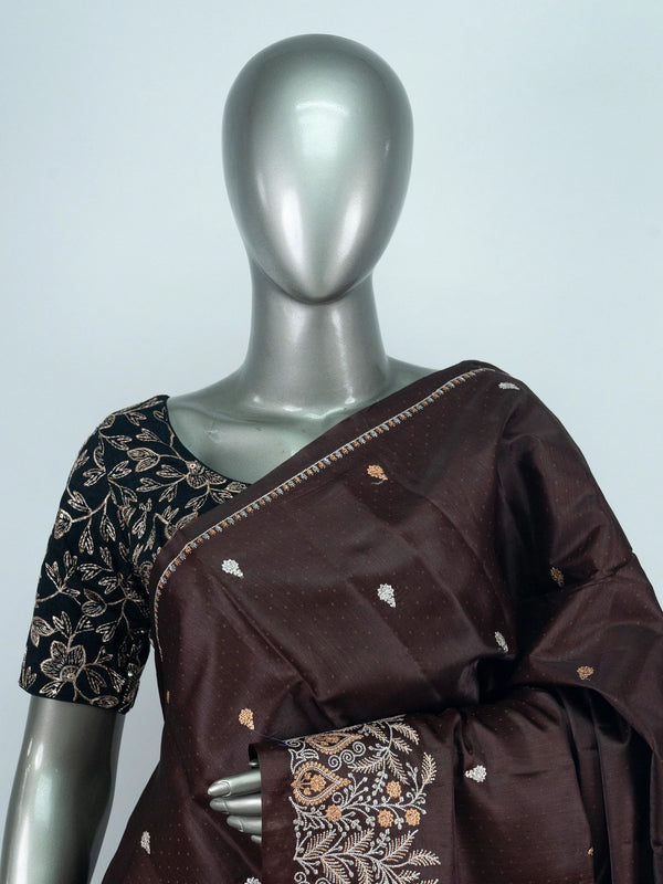 Dark chocolate brown semi raw silk saree with embroidered floral pallu and contrast black blouse