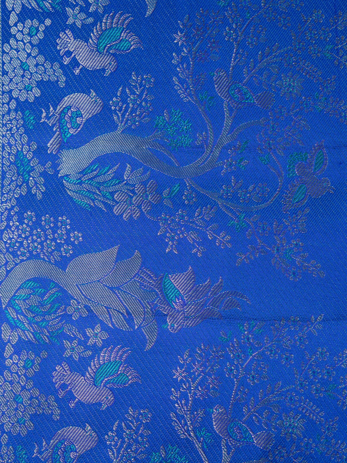 Green pure Kanchipuram silk saree with gold zari brocade and contrast royal blue peacock-motif border