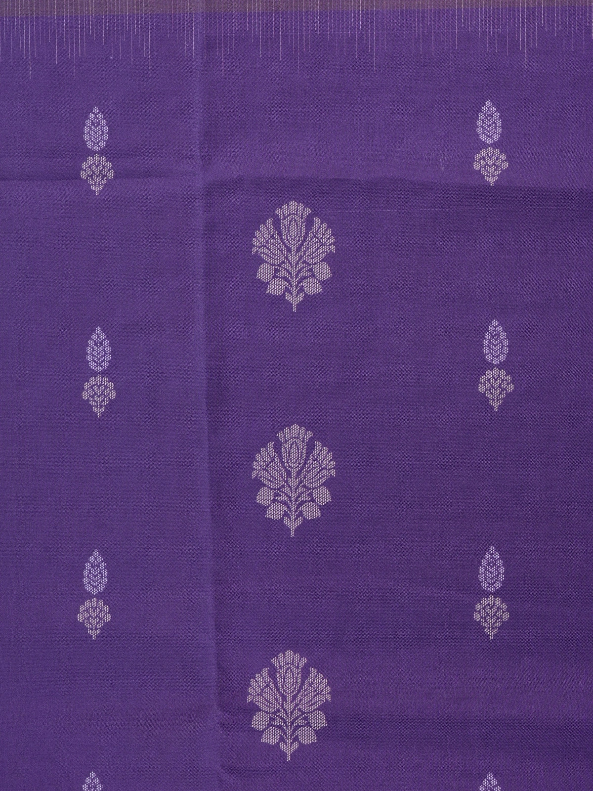 Purple Dola silk saree with lavender contrast border, floral buttas, and patterned pallu