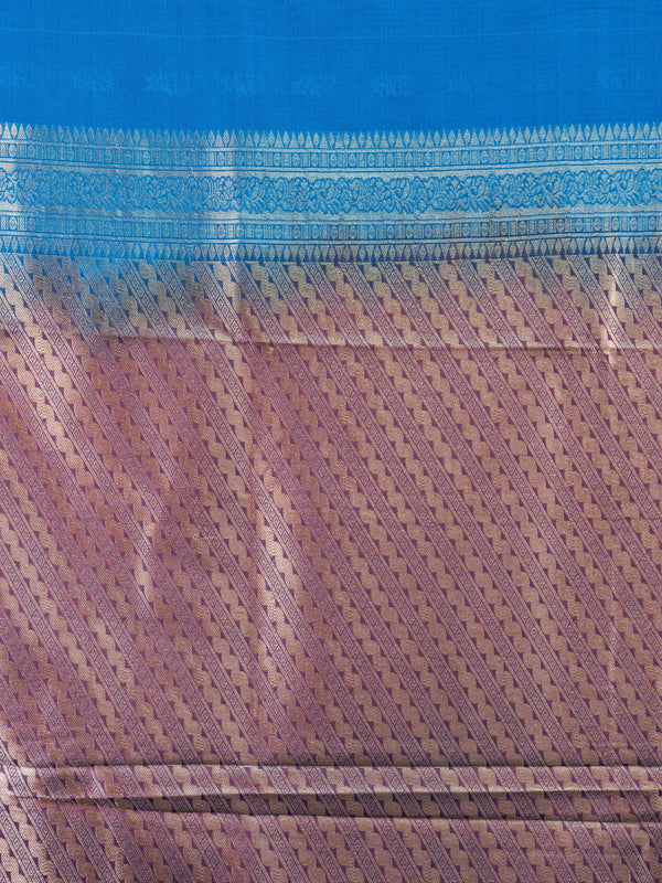 Peacock blue semi silk saree with contrast purple border and silver zari pallu