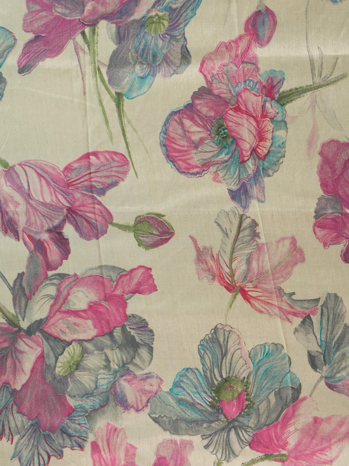 Beige Dola silk saree with pink and blue floral print and contrast teal zari border