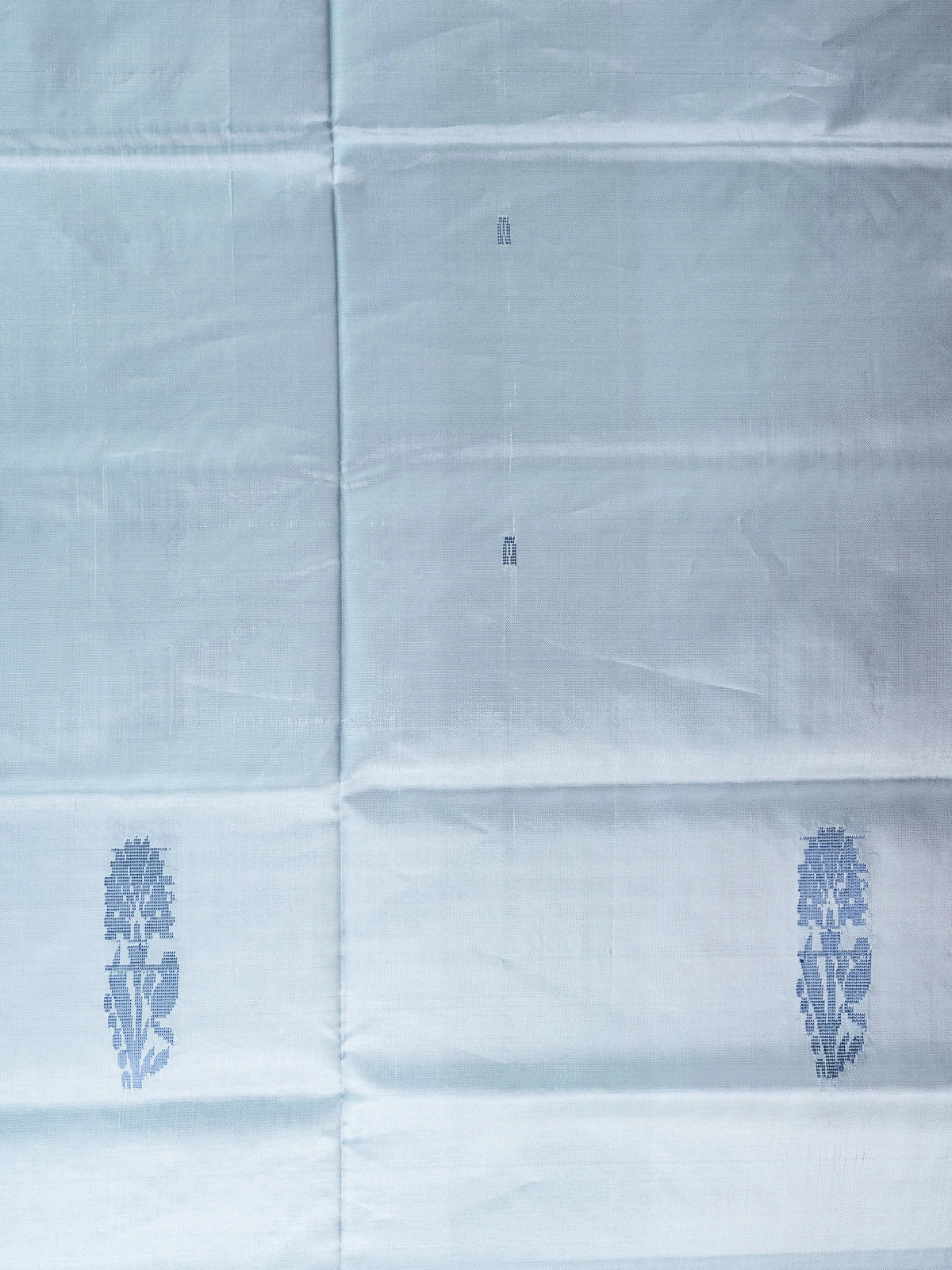 Grey-blue Banana Silk saree with blue buta motifs and a contrast red pallu with gold zari stripes