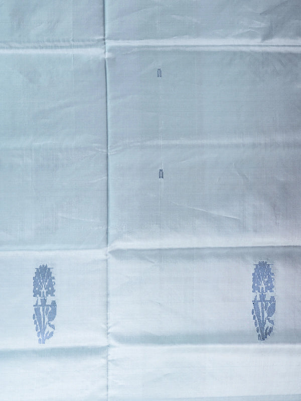 Grey-blue Banana Silk saree with blue buta motifs and a contrast red pallu with gold zari stripes