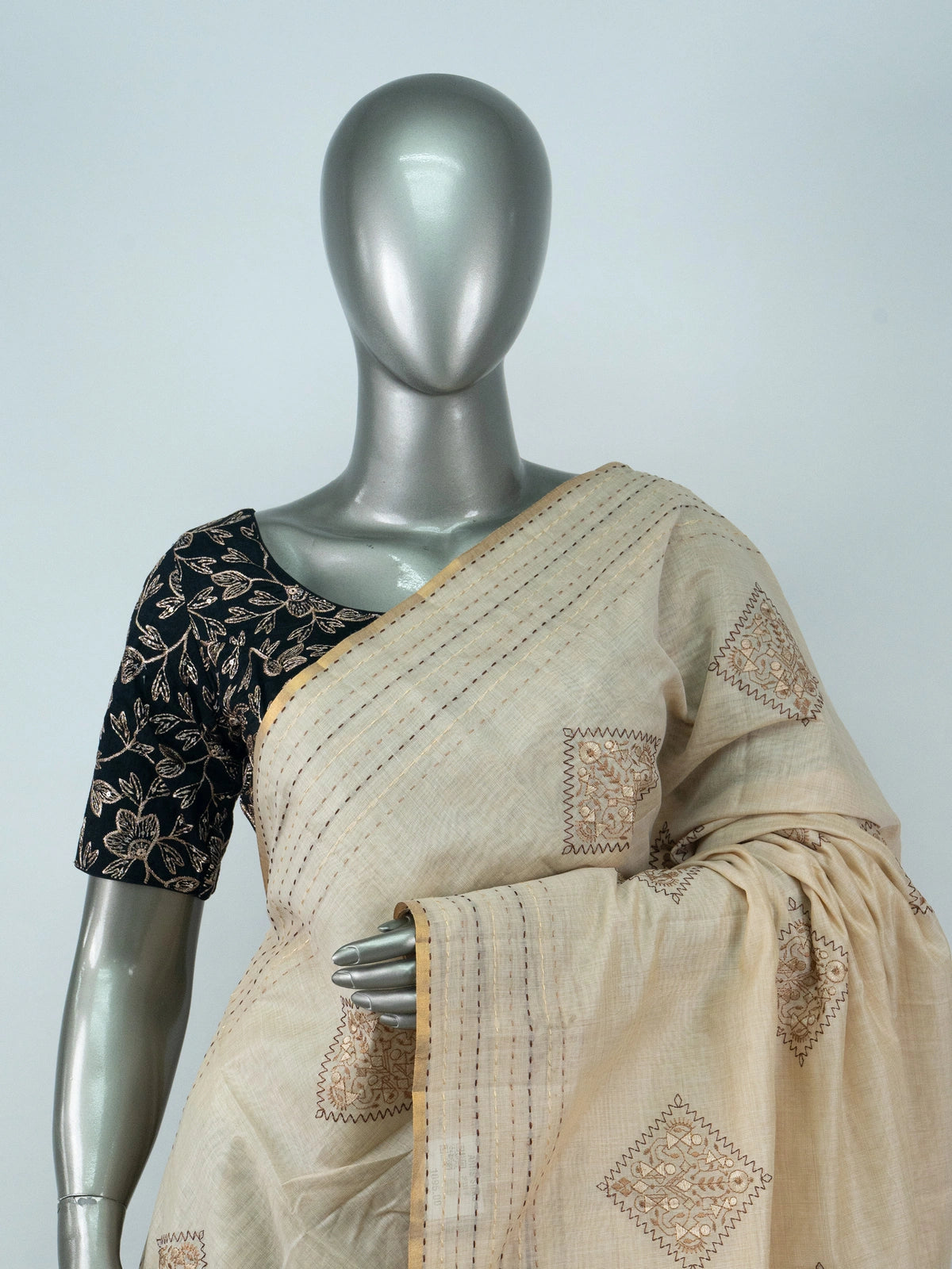Cream linen cotton saree with gold zari border and embroidered diamond motifs