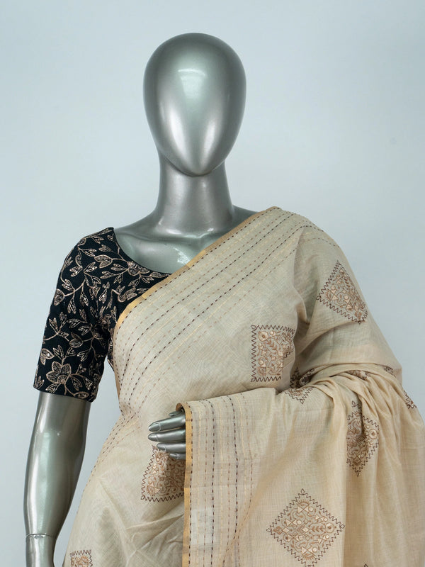 Cream linen cotton saree with gold zari border and embroidered diamond motifs
