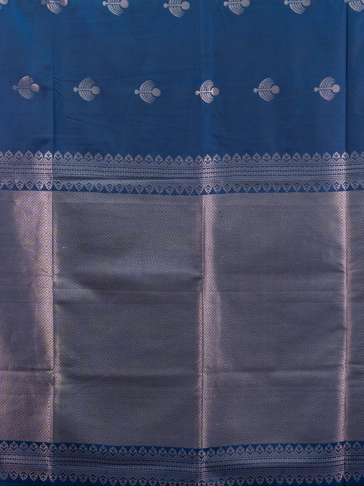 Navy blue Kanchipuram Fancy Silk saree with silver zari buttas and contrast light-blue border