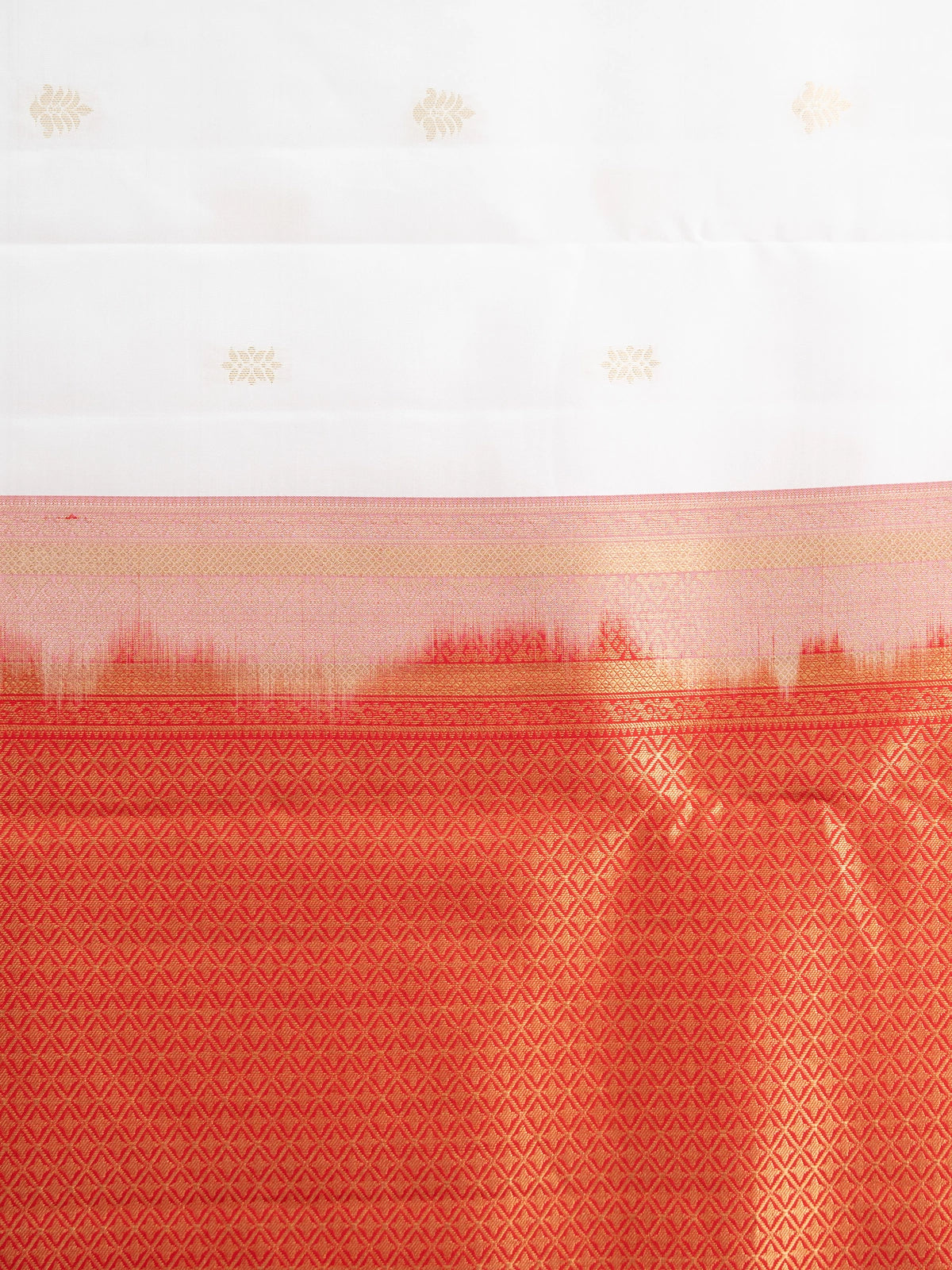 White pure Kanchipuram silk saree with contrast red border and gold zari buttas and pallu