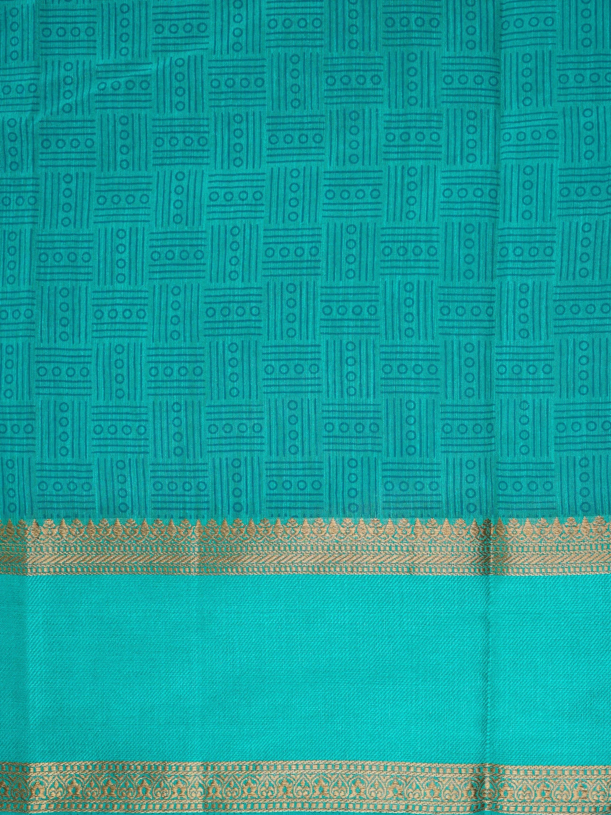 Teal green semi tussar saree with geometric body pattern and gold zari border
