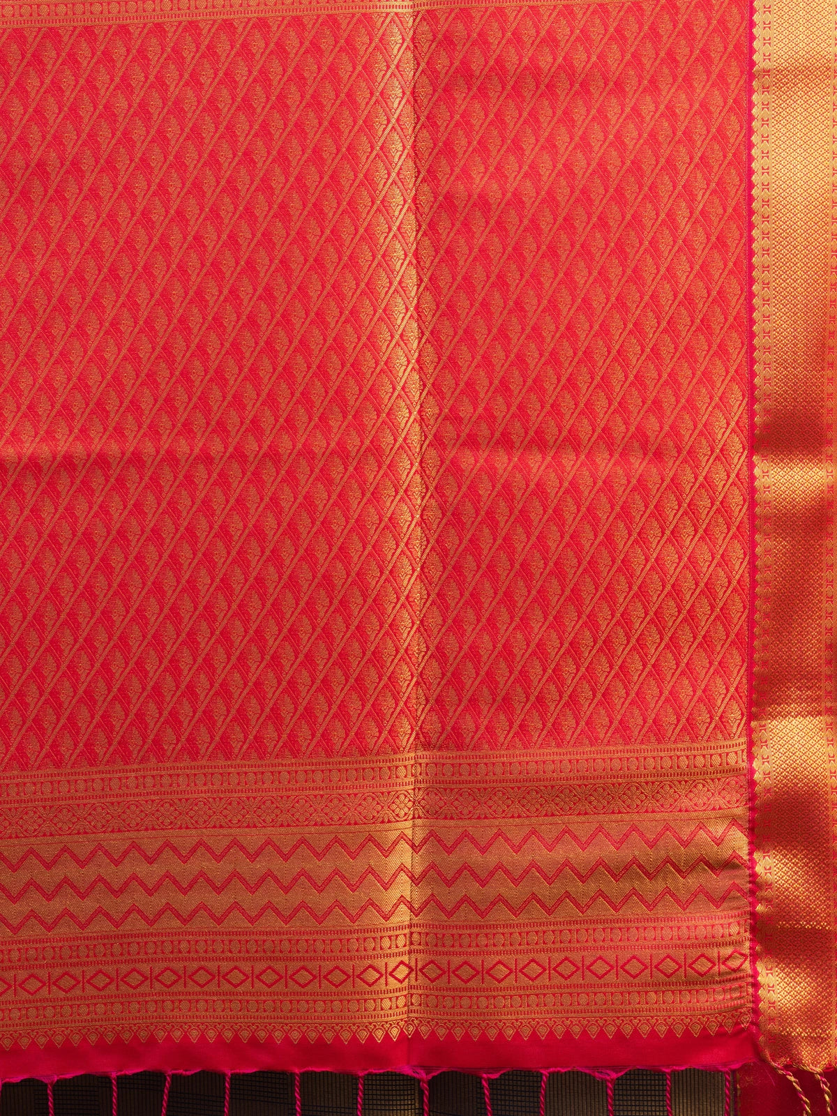 Navy blue Kanchipuram fancy silk saree with gold zari checks and contrast orange-red zari border and pallu