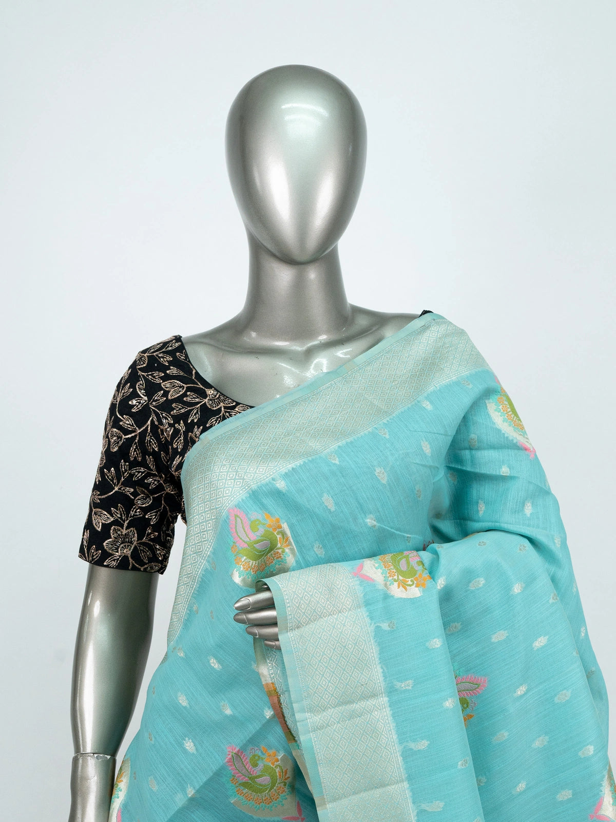 Aqua blue linen cotton saree with silver zari border, colourful peacock motifs and contrast black blouse