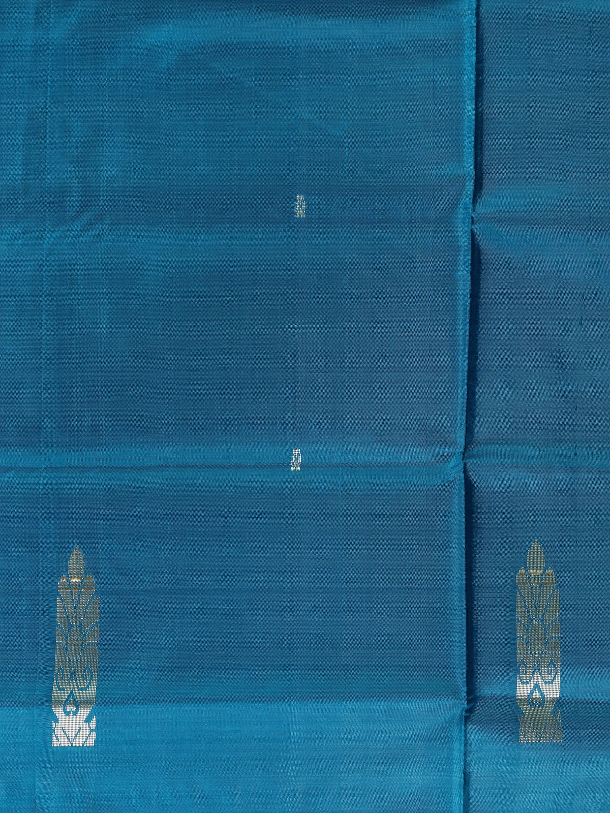 Peacock teal blue Banana Silk saree with silver zari buttas and contrast silver-grey pallu