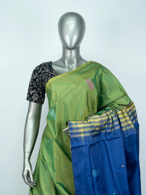 Green Banana Silk saree with royal blue contrast pallu, woven buttas and yellow-blue zari border