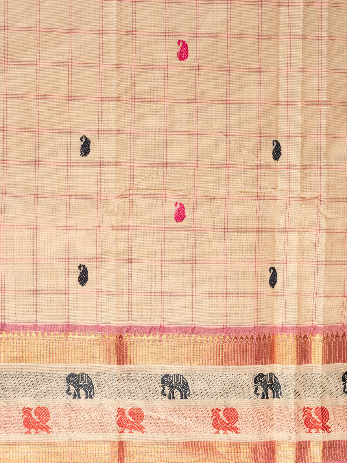 Beige and pink checked Chettinad cotton saree with gold zari border and paisley buttas
